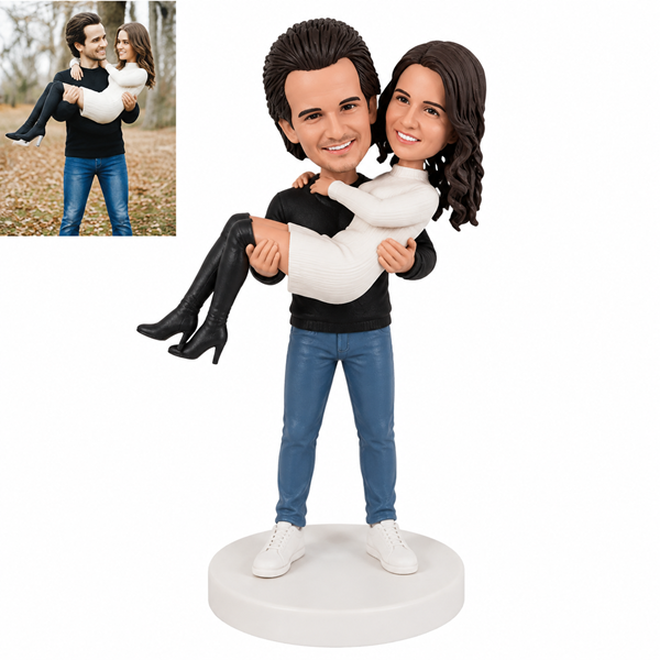 Couple bobblehead man carrying woman1